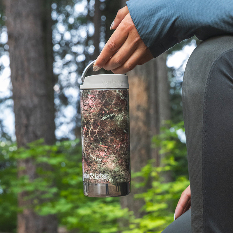 12oz-tkwide-with-twist-cap-mossy-oak-l5 12oz_tumbler_mossyoak_rainbowtrout_hand_closeup_square.jpg