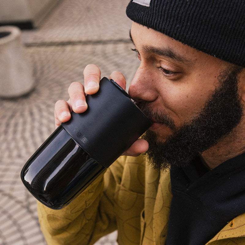16oz-rise-tumbler-y6 16oz_rise_tumbler_black_man_drink_square.jpg