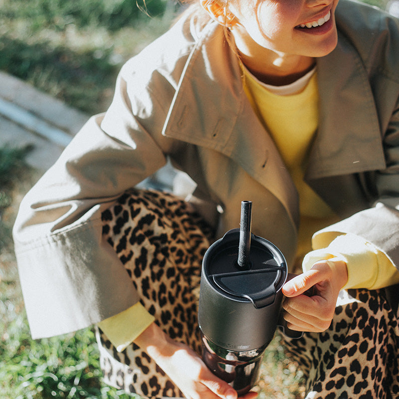 26oz-rise-tumbler-with-straw-lid-t6 26oz_rise_tumbler_black_woman_topview_square.jpg