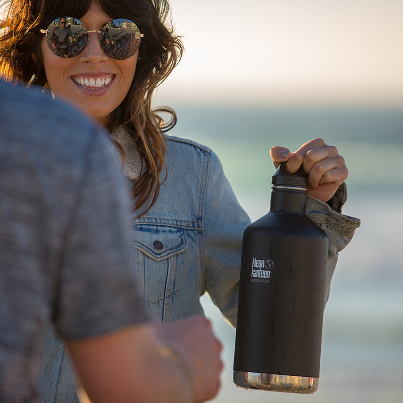64oz-classic-with-loop-cap-y5 64oz_insulated_classic_black_beach_girl_hand_square.jpg
