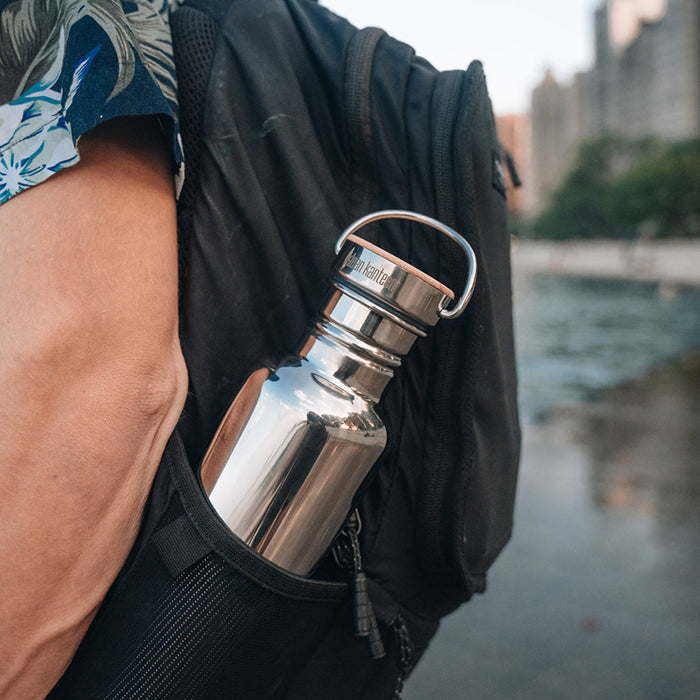 27oz-reflect-with-bamboo-cap-i3 K27SSLRF-MS-BAMBOO_reflect-bottle_backpack_lifestyle.jpg